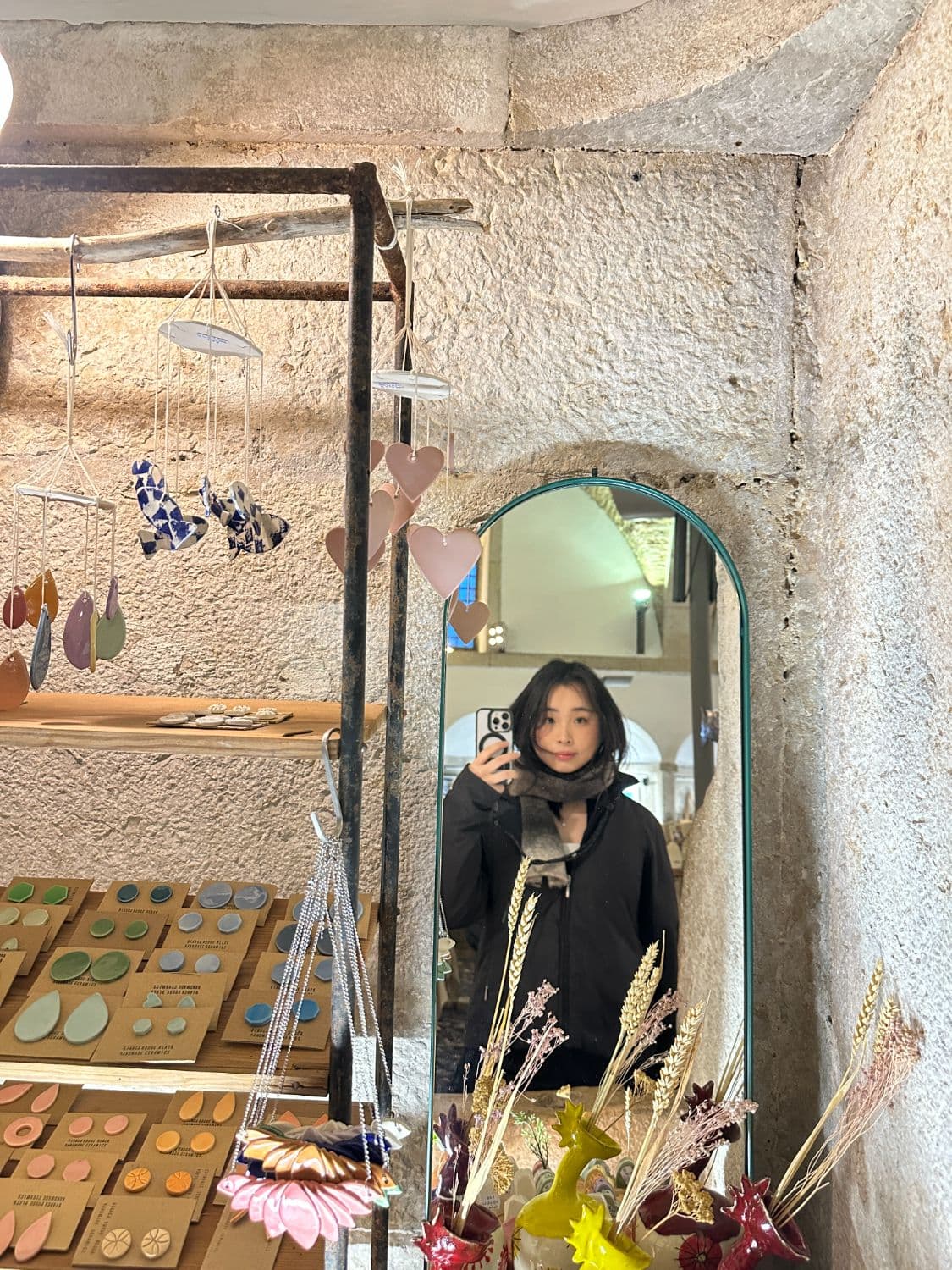 Mirror selfie in a ceramics shop
